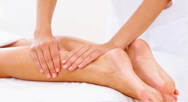 Physiotherapist massaging a leg